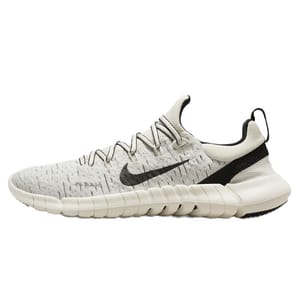 A white Nike Free Run sneaker with black swoosh logo and a black and white sole.