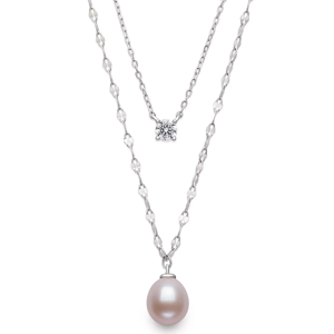 Layered necklace featuring a white pearl pendant on a decorative chain and a single diamond on a simple chain.