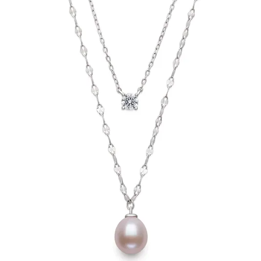 Layered necklace featuring a white pearl pendant on a decorative chain and a single diamond on a simple chain.