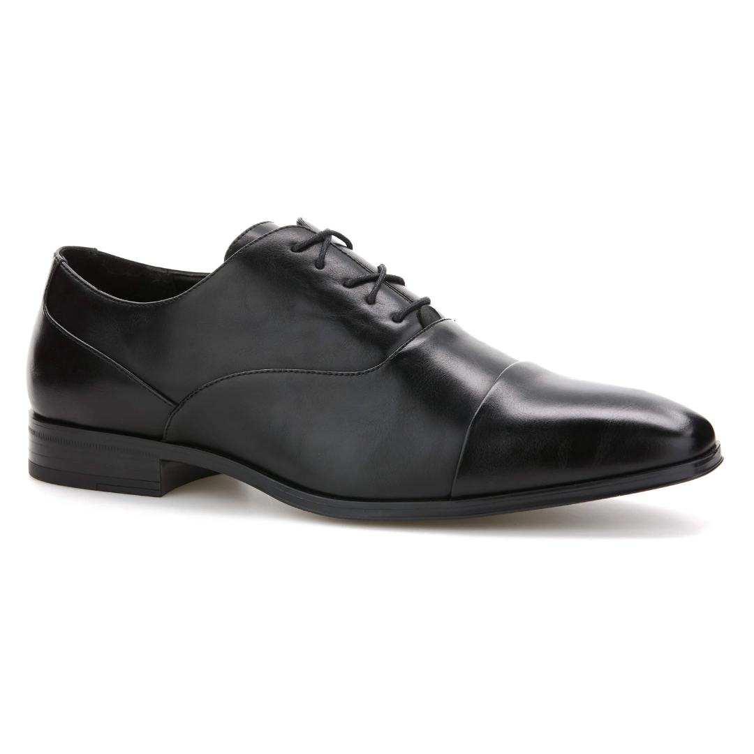 Black leather dress shoe with a cap toe design and low heel, featuring lace-up closure.