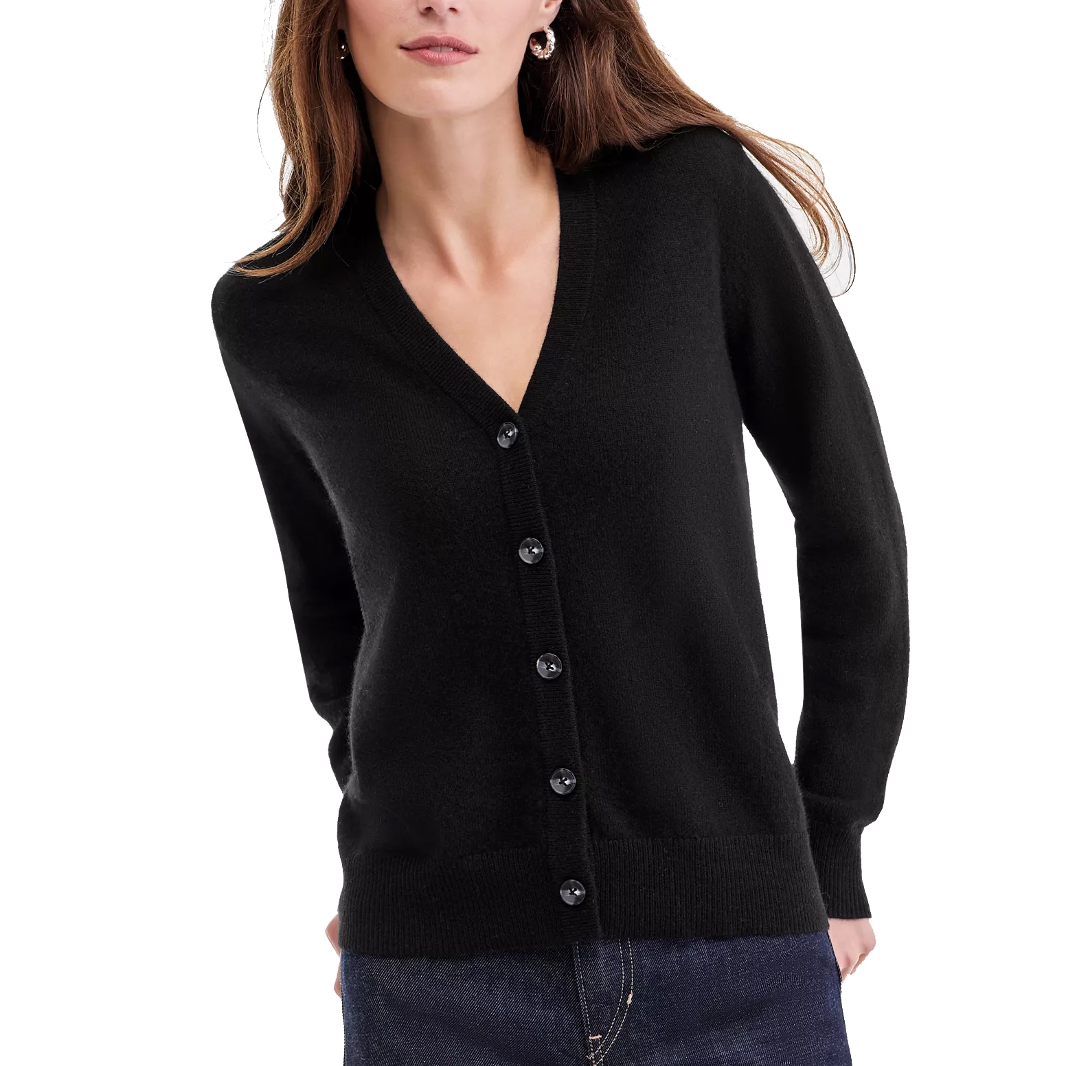 A woman is wearing a black button-up cardigan with a V-neck and long sleeves, paired with dark denim jeans.