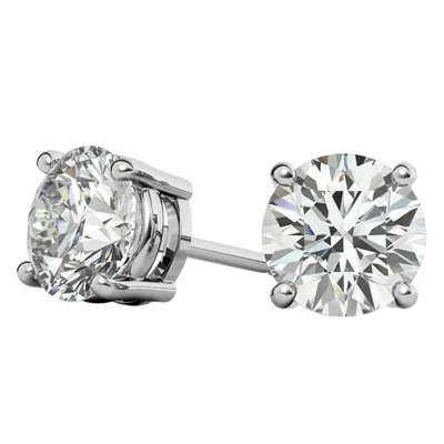 Pair of round-cut diamond stud earrings set in a four-prong setting with a polished metal back, likely platinum or white gold.