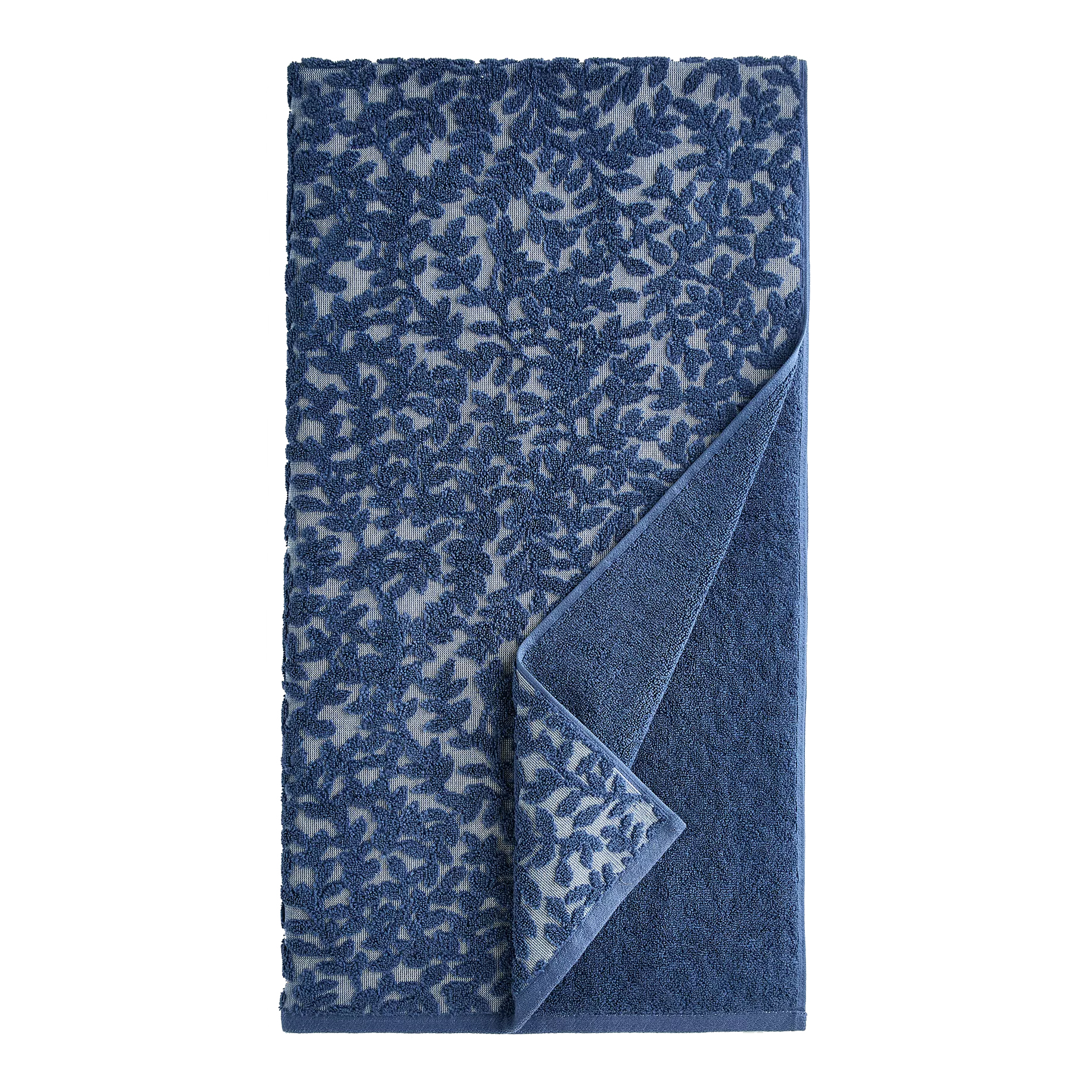 A blue towel featuring a leafy pattern with the fabric slightly folded to show the reverse side, which is a solid blue color.