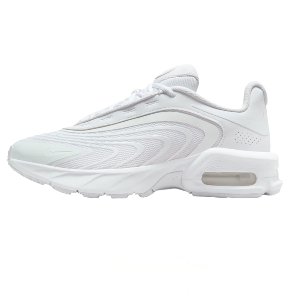 White athletic sneaker with a breathable mesh upper, textured wavy design, and visible air cushioning in the heel.