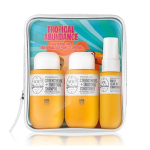 A hair care set featuring a shampoo, conditioner, and a leave-in conditioner, packaged in a clear travel pouch with a tropical design.