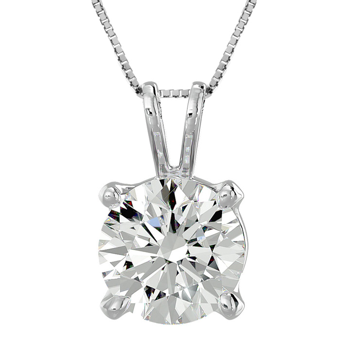 A silver necklace with a round-cut diamond pendant set in a four-prong setting.