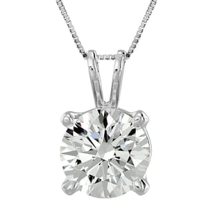 A silver necklace with a round-cut diamond pendant set in a four-prong setting.