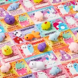 28ct Mochi Squishy Valentines feature cute, colorful squishy toys shaped like animals, paired with Valentine's Day cards that have playful messages such as \“I love you so mochi\“ and \“Gimme a squeeze, Valentine!\“