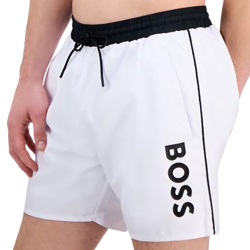 White swim shorts with a black drawstring, side piping, and bold \“BOSS\“ lettering on the left leg.