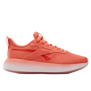 Coral-colored Reebok running shoe with a sleek design and a white gradient sole.