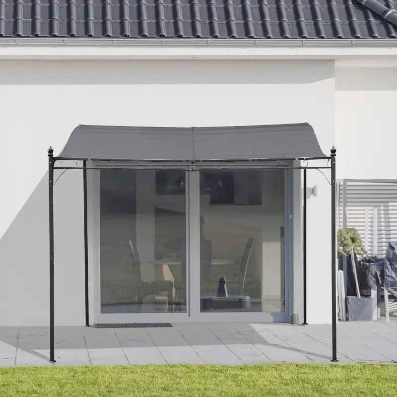 A retractable side awning attached to the exterior of a house, providing a shaded patio area.