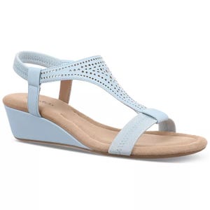 Light blue wedge sandal with a perforated design, featuring an elastic back strap and a comfortable footbed.