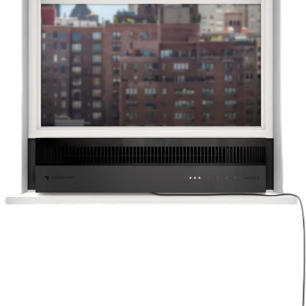 A window-mounted air conditioner with a sleek black design and minimal controls on the front panel, set against an urban background.