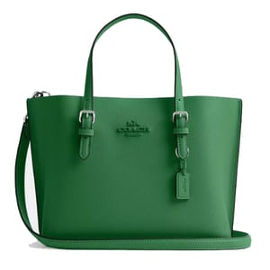 A green leather tote bag with dual handles and an adjustable shoulder strap, featuring a subtle embossed logo and a small hanging tag.