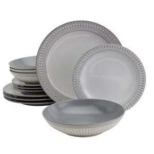 A dinnerware set featuring plates and bowls with a two-tone design; the exterior has a subtle ribbed pattern and the interior is smooth gray.