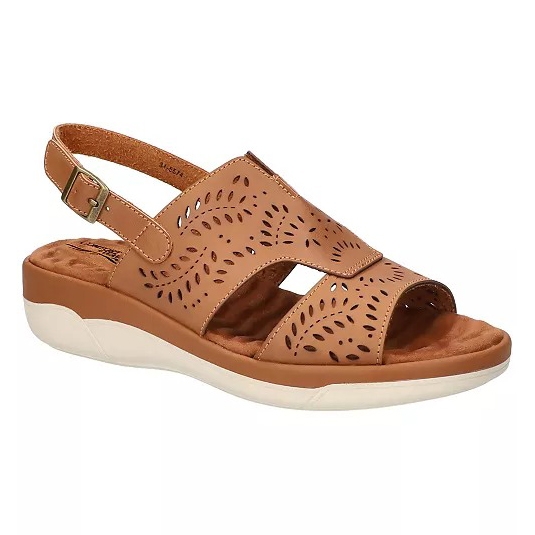 Brown sandal with a perforated floral design, adjustable ankle strap, cushioned insole, and a slight heel.