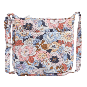 Vera Bradley XL Crossbody with a floral pattern in pink, blue, and beige hues. It features an adjustable strap and quilted texture.
