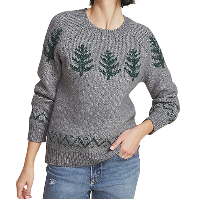 Gray sweater with green tree and zigzag patterns. Paired with distressed blue jeans.