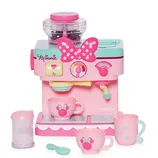 Pink and teal toy coffee maker with Minnie Mouse theme, featuring cups, a milk jug, and a sugar container, adorned with Minnie logos and bows.