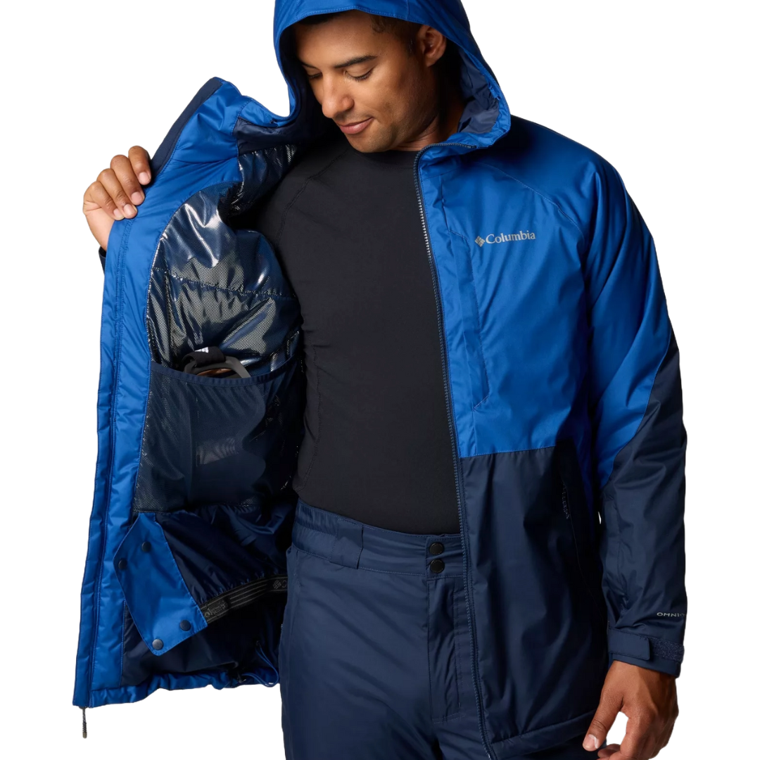The Columbia Snowy Summit Jacket is a blue, hooded, insulated winter jacket featuring a front zipper, adjustable cuffs, and inner pockets, designed for warmth and weather protection.