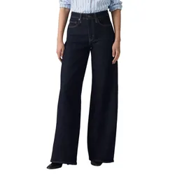A person is wearing high-waisted, dark wash, wide-leg jeans paired with a light blue pinstriped shirt.