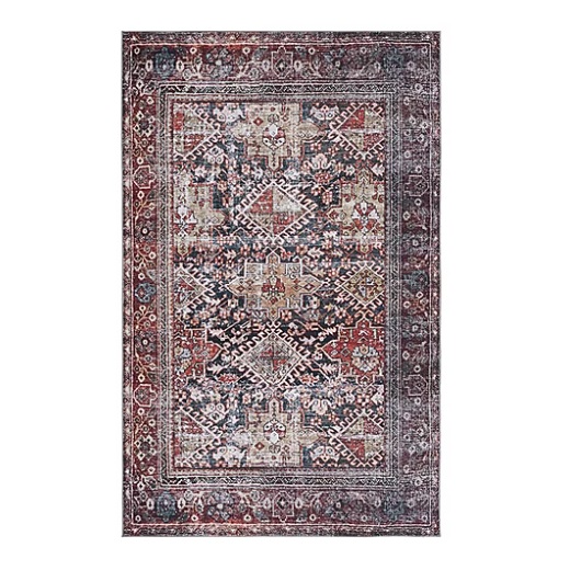 A rectangular area rug with an intricate geometric pattern in red, blue, and beige tones, featuring traditional motifs and a wide decorative border.