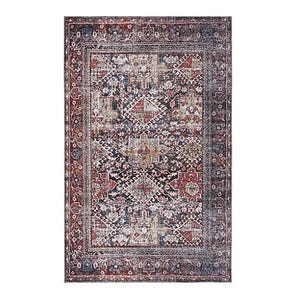 A rectangular area rug with an intricate geometric pattern in red, blue, and beige tones, featuring traditional motifs and a wide decorative border.