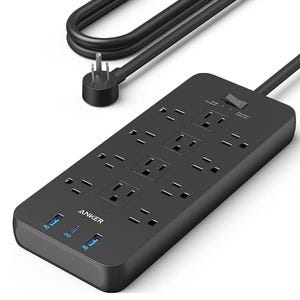 Black Anker 12-outlet surge protector with USB ports, featuring multiple grounded outlets, a flat plug, and an on/off switch for overload protection. Includes USB-A and USB-C ports labeled \“IQ\“ and \“PD\“ for device charging.