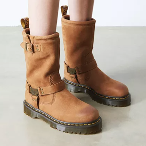 Brown leather mid-calf boots with buckles and thick lug soles, featuring yellow stitching.