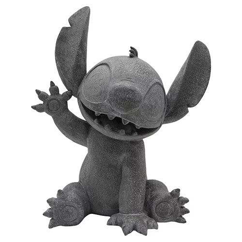 A gray stone-like figure of Stitch from Disney's \“Lilo & Stitch,\“ featuring a playful pose with one arm raised.