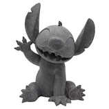 A gray stone-like figure of Stitch from Disney's \“Lilo & Stitch,\“ featuring a playful pose with one arm raised.