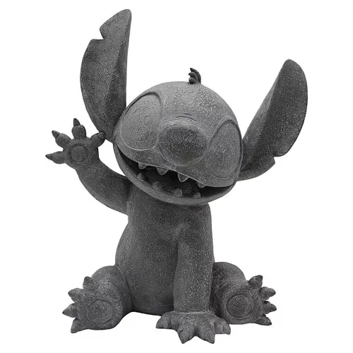 A gray stone-like figure of Stitch from Disney's \“Lilo & Stitch,\“ featuring a playful pose with one arm raised.