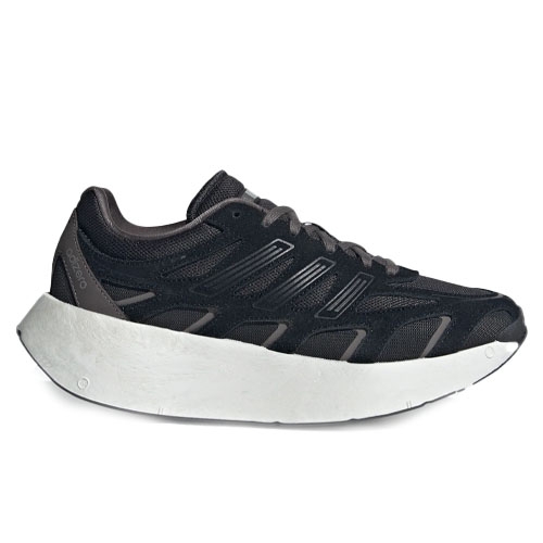 A black athletic shoe with a thick white sole, featuring a sleek, modern design with distinct detailing on the sides.