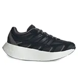 A black athletic shoe with a thick white sole, featuring a sleek, modern design with distinct detailing on the sides.