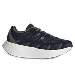 A black athletic shoe with a thick white sole, featuring a sleek, modern design with distinct detailing on the sides.