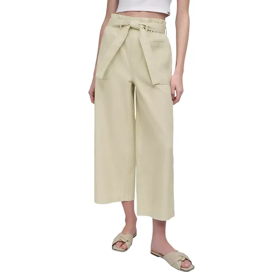 Beige paperbag waist cropped pants with a tie belt, paired with a white crop top and beige slip-on sandals.