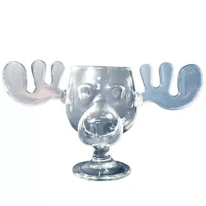 A glass shaped like a moose head, featuring antlers and a nose, used as a novelty drinking vessel.