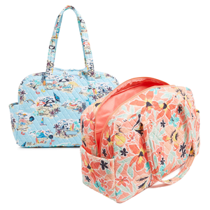 Two quilted fabric bags with floral patterns, one in pastel blue with beach motifs and the other in shades of coral and peach.