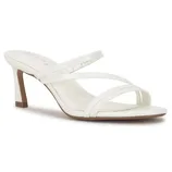White mule sandal with a mid-height heel and three slender straps across the foot, featuring a textured finish.