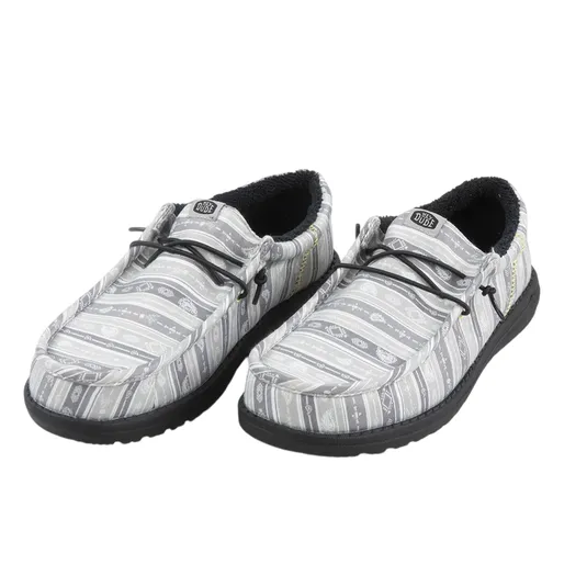 Casual slip-on shoes with a patterned gray and white fabric upper, featuring black laces and a dark sole. The shoes have a cozy, padded interior, likely designed for comfort.