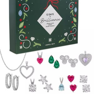 A \“12 Days of Brilliance\“ sterling silver jewelry advent calendar from Macy's features various earrings and pendants, including heart, star, and pear-shaped designs, with a mix of colorful stones and cubic zirconia.