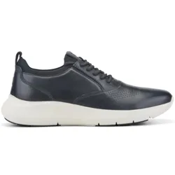 A sleek, dark navy sneaker with perforated detailing and a contrasting white sole featuring a low top design and lace-up closure.