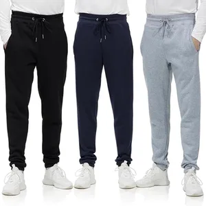 Three pairs of men's jogger sweatpants in black, navy, and gray, each featuring a drawstring waistband and pockets. They are worn with white sneakers and white long-sleeve shirts.