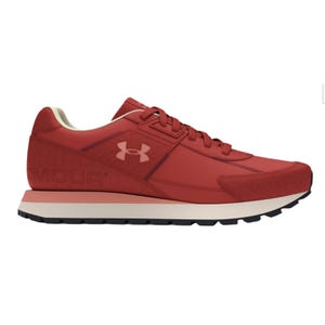 Red athletic sneaker with a sleek design, featuring the Under Armour logo on the side, lace-up closure, and a black rubber sole for traction.