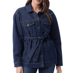 A woman is wearing a dark denim jacket with a tied belt at the waist, featuring buttoned front pockets and long sleeves.