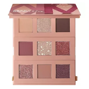 An eyeshadow palette featuring three rows of different shades, including matte and shimmery colors in neutral and pink hues.
