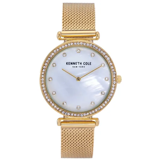 A Kenneth Cole New York gold watch with a mother-of-pearl dial, crystal hour markers, and a crystal-embellished bezel, featuring a gold mesh strap.