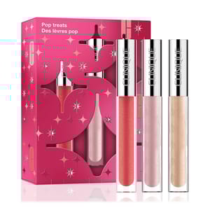 Clinique Pop Treats gift set includes three lip glosses in pink, red, and gold shades, presented in a decorative pink box with star designs.