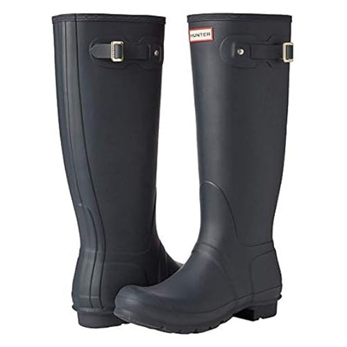 Pair of tall black rubber rain boots with adjustable side straps and a logo at the top.