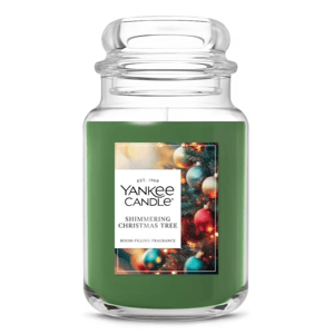 A Yankee Candle in the \“Shimmering Christmas Tree\“ fragrance, featuring a green color and holiday-themed label.